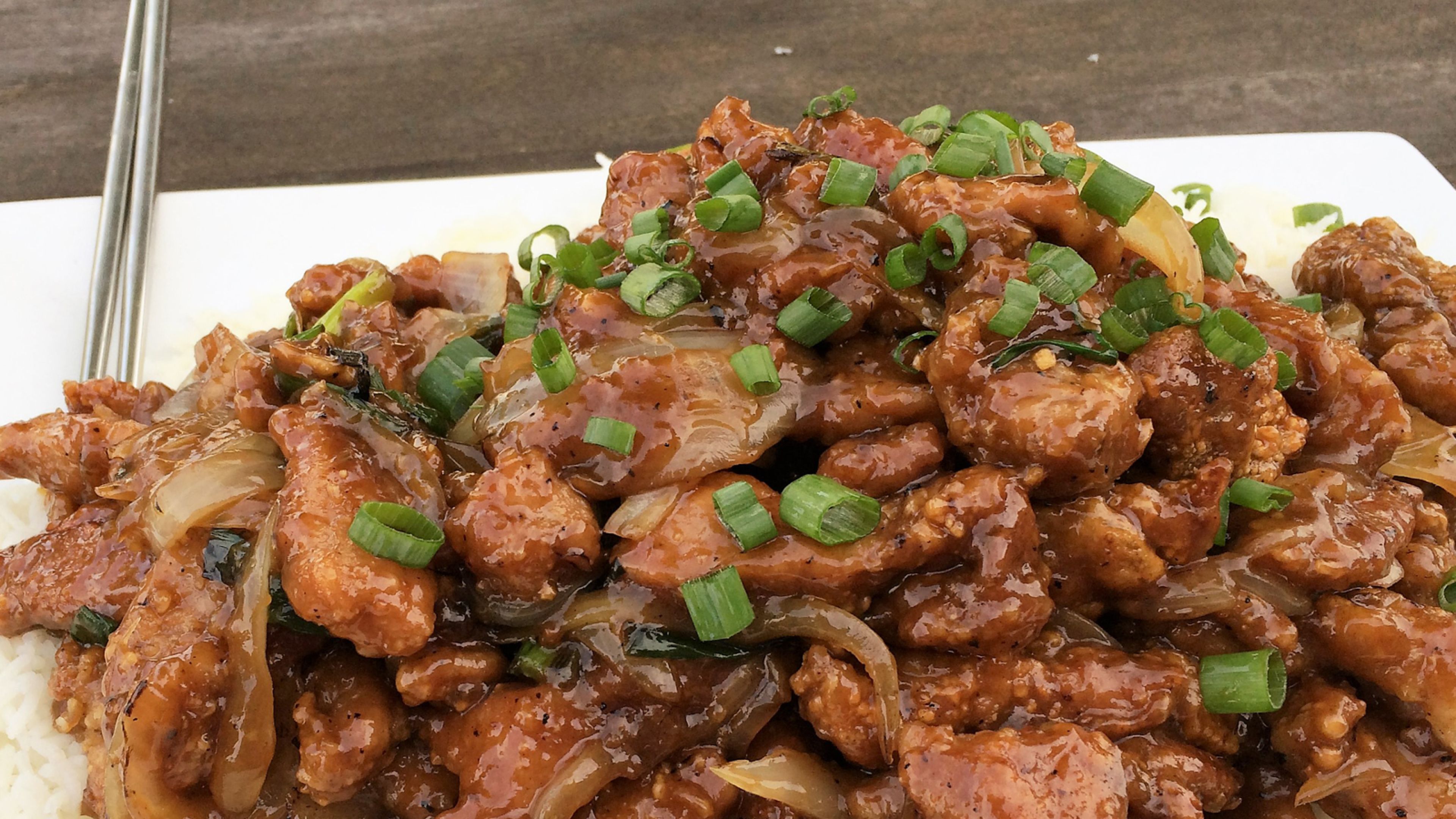 Move over Mongolian beef! This Crispy-Sweet Pork and Onions recipe delivers tender pork, caramelized onions, and a finger-licking sauce. Yes, it's a little messy, but you'll forgive it after the first bite.