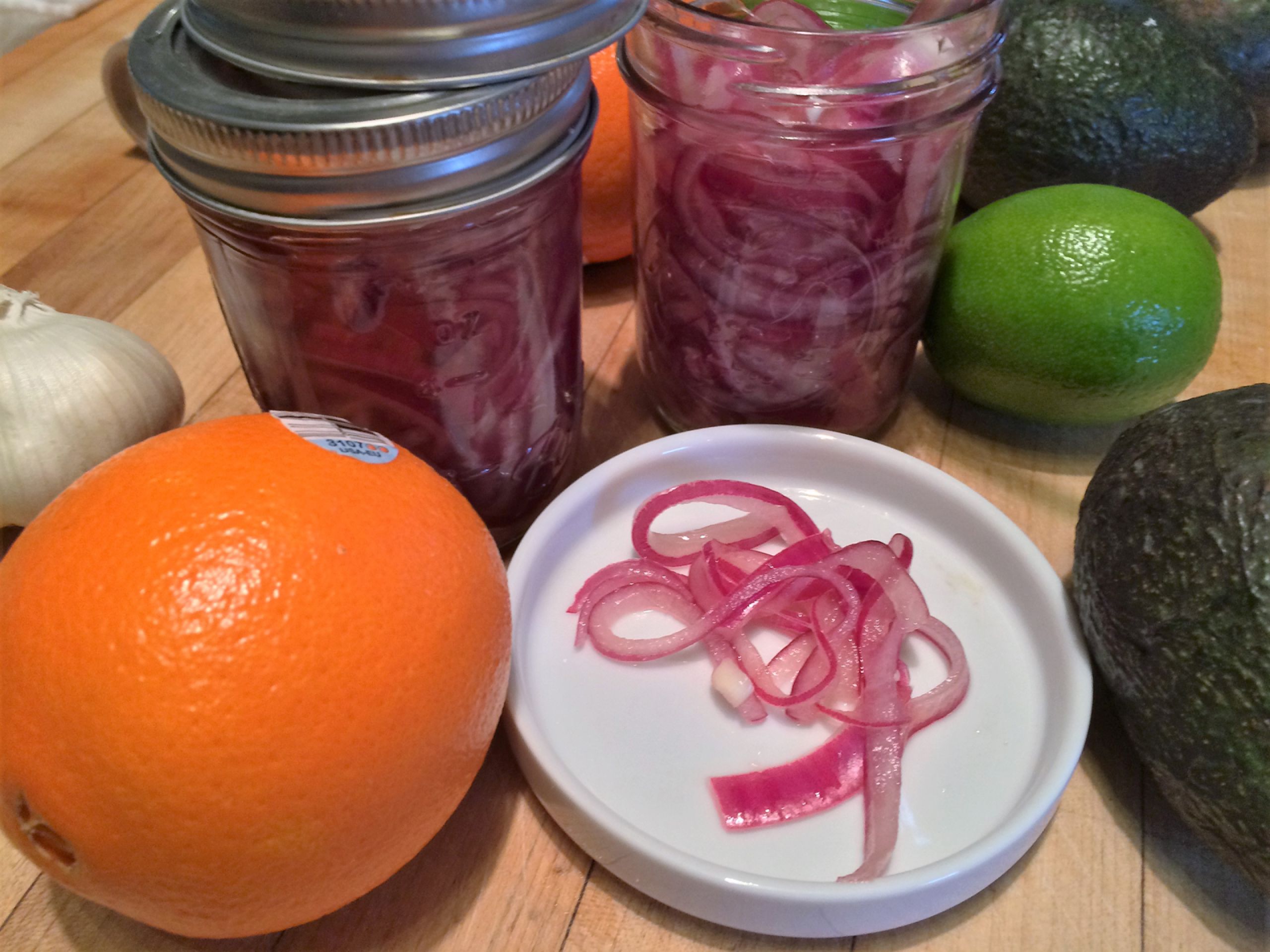 These pickled red onions are a tangy, slightly sweet, and downright magical addition to tacos, sandwiches, or anything that needs a zing of flavor. Quick, simple, and a total flavor bomb!