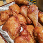 Sriracha Maple Fried Chicken combines crispy fried chicken with a sticky, spicy-sweet glaze that’s irresistible. Perfect on its own or piled high on waffles.