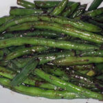 Crisp, savory, and coated in a rich sauce, these green beans will make you forget all about takeout. A quick, easy side dish that’s packed with flavor and ready in no time!